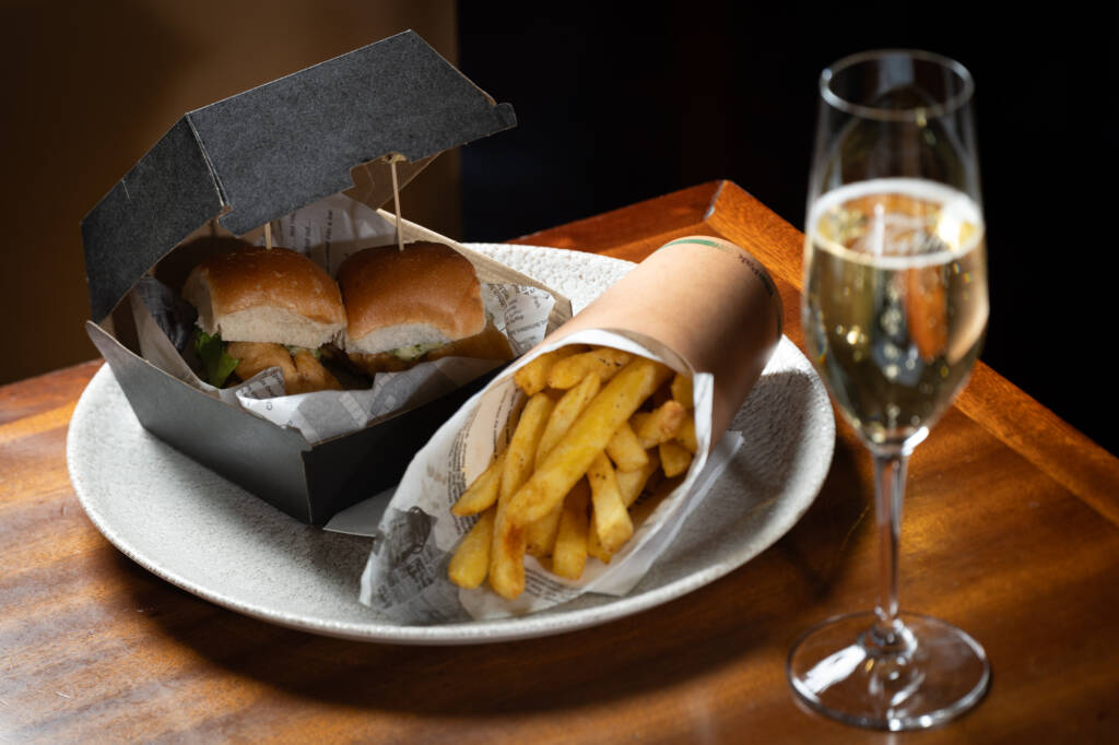 Image of the Adult Happy Meal -2 snapper sliders and a glass of champagne