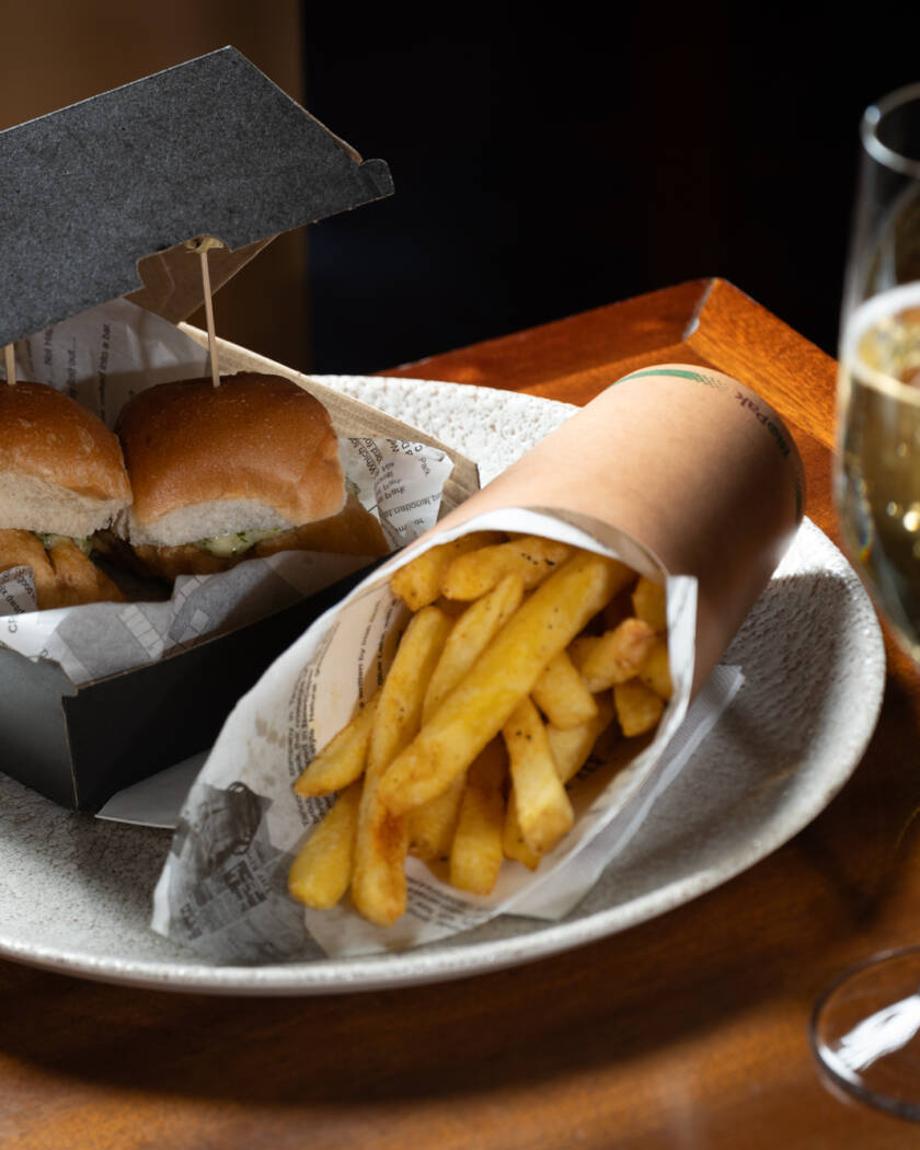 Image of the Adult Happy Meal -2 snapper sliders and a glass of champagne