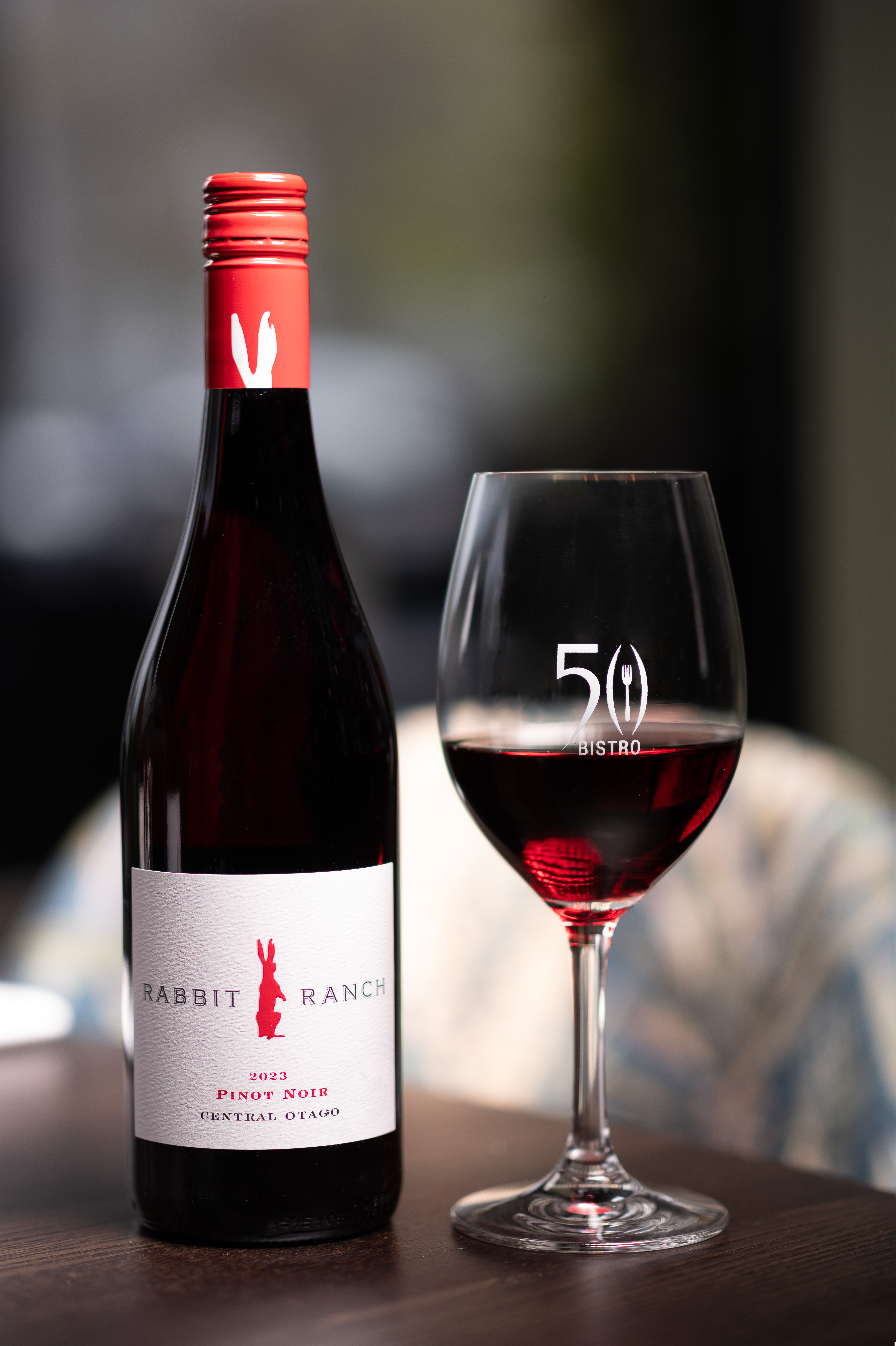 Glass of Rabbit Ranch Pinot Noir poured in 50 Bistro, at The George